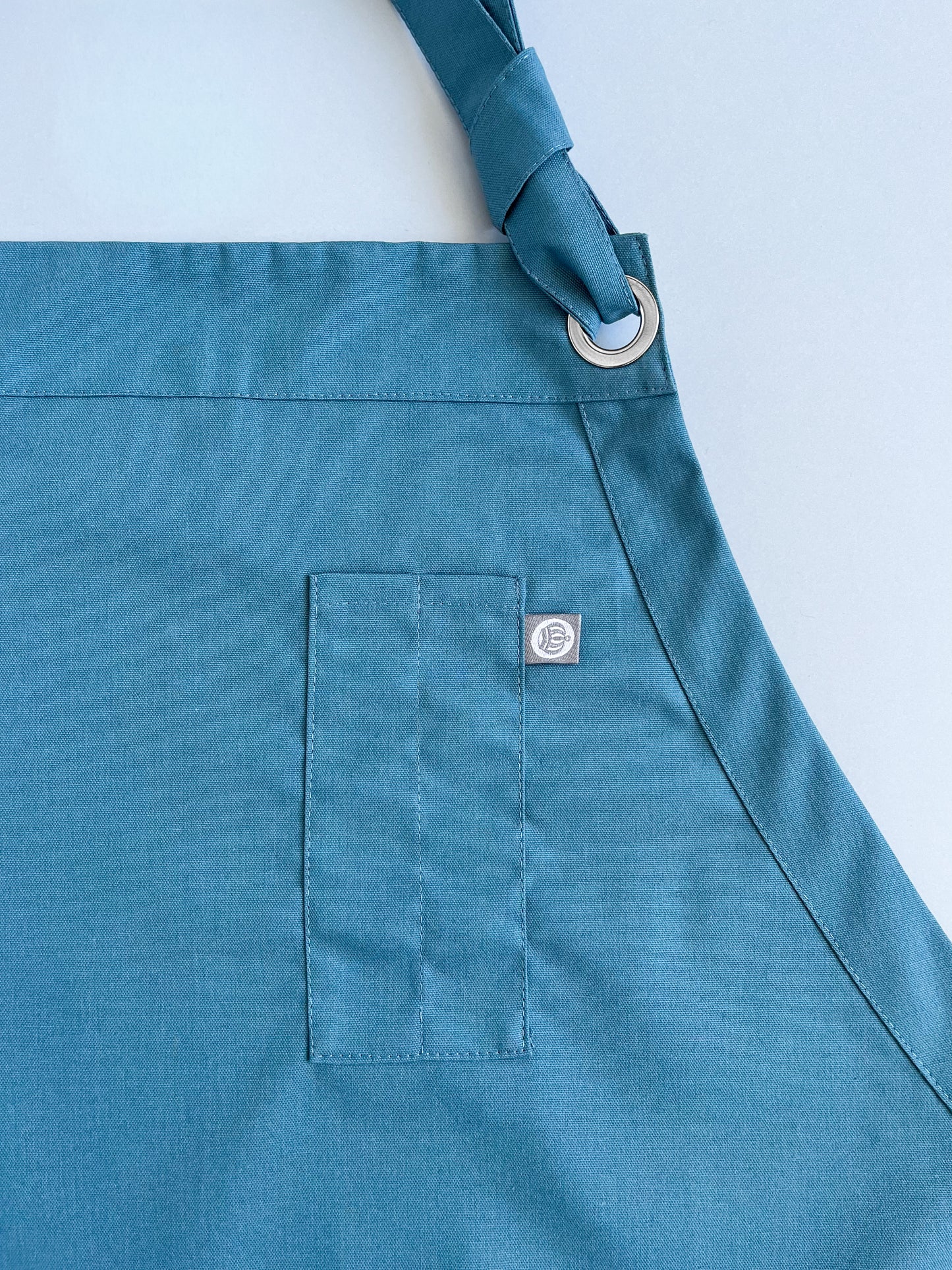 pechera CAM en tela Oxford color petróleo