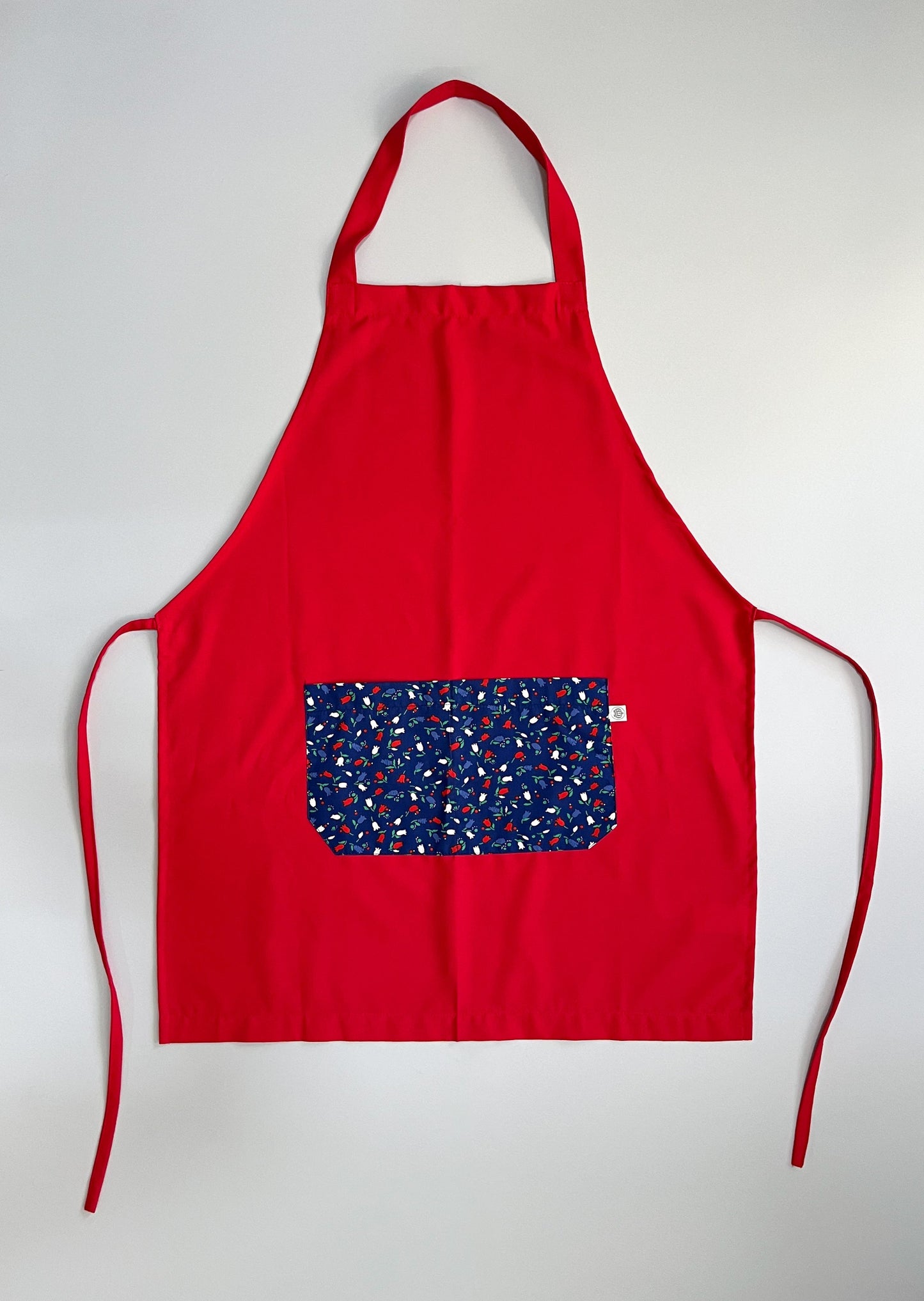 Pechera Carpintero roja con bolsillo en flores